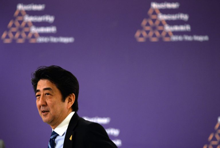 Japanese Prime Minister Shinzo Abe attends a bilateral meeting with the German chancellor on the sidelines of the Nuclear Security Summit (NSS) in The Hague on March 25, 2014. The world must construct a system to fight nuclear terror with the world's atomic watchdog playing a central role, a draft of the Nuclear Security Summit's final statement says.